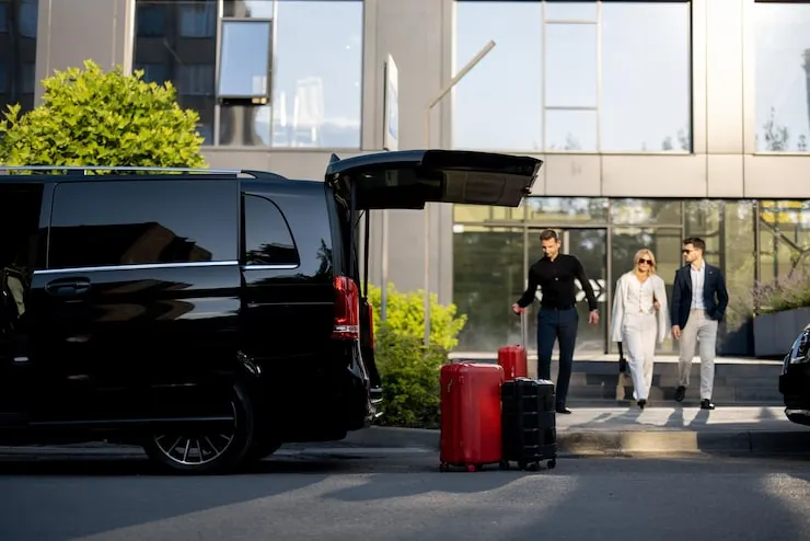 Private driver helping travellers with their luggage in Morocco
